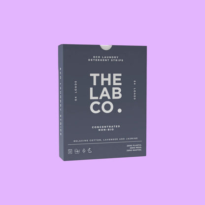 The Lab Co. Relaxing Laundry Detergent Strips in a dark blue plastic-free box for 64 loads of eco-friendly wash.