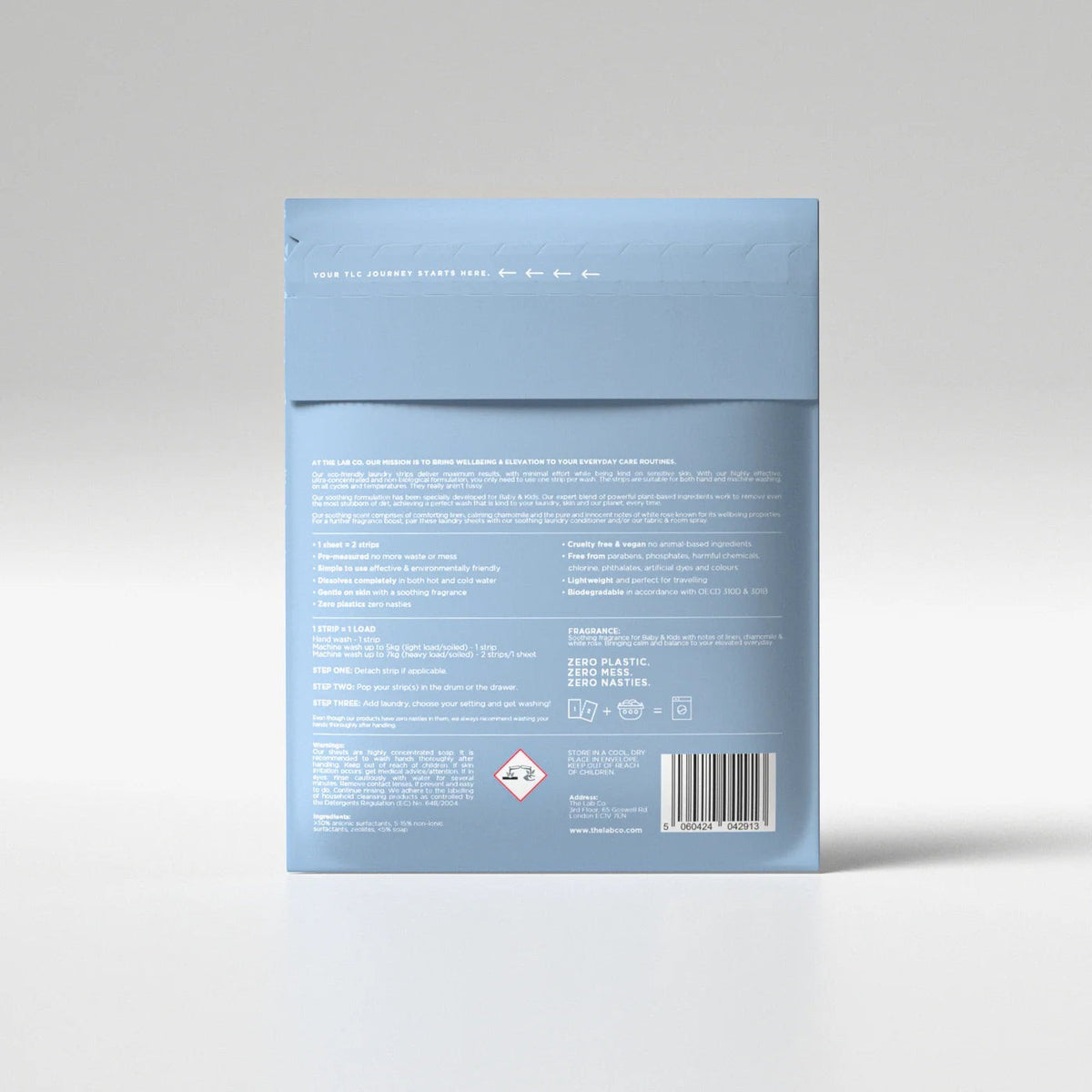 The Lab Co. soothing laundry detergent strips in a plastic-free, light blue recyclable paper envelope packaging.