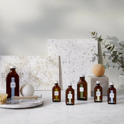 Tincture London all purpose cleaner starter kit with amber glass bottles and natural cleaning concentrates.