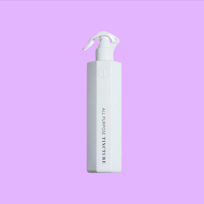 Tincture London antimicrobial white octagonal spray bottle for all-purpose cleaning with safety lock trigger.