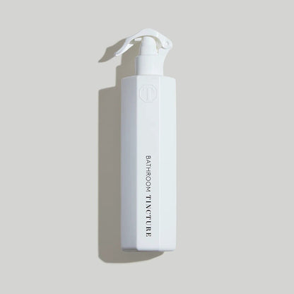 Tincture London antimicrobial white octagonal bathroom cleaner spray bottle with safety lock trigger