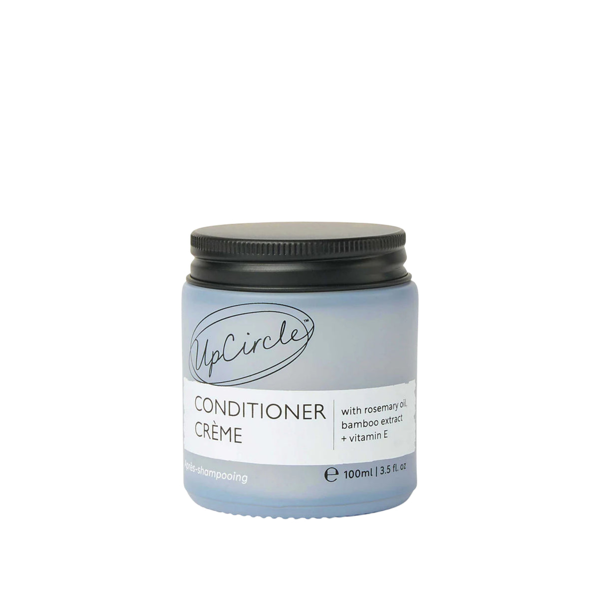 UpCircle conditioner crème in a frosted glass jar with black lid, featuring rosemary oil and bamboo extract.