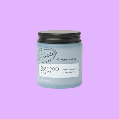 UpCircle refillable shampoo crème in a 100ml frosted glass jar with black lid and coconut and rosemary oil