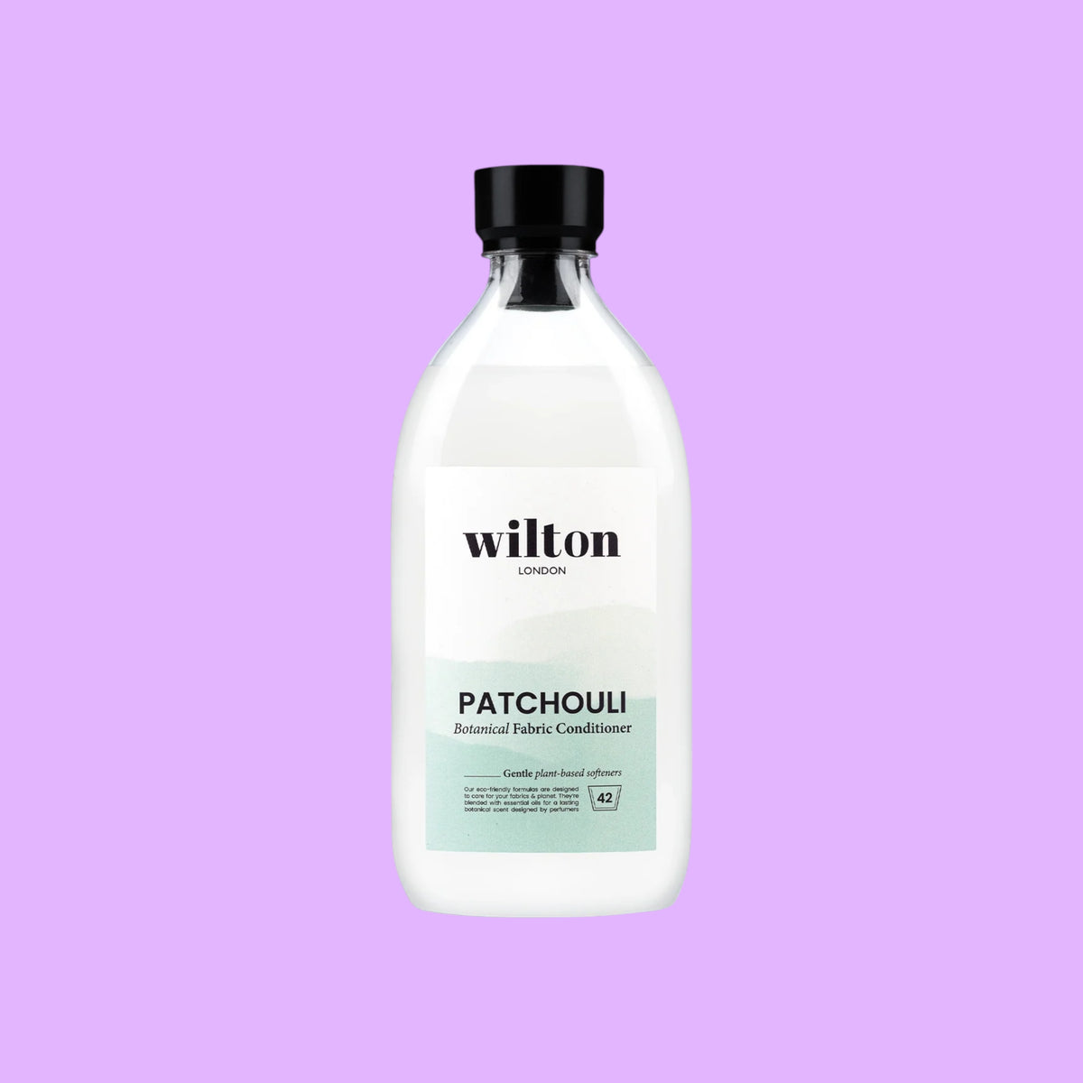 Wilton London Patchouli plant-based fabric conditioner in a 1.05L clear bottle with a black cap, shown from a different angle.