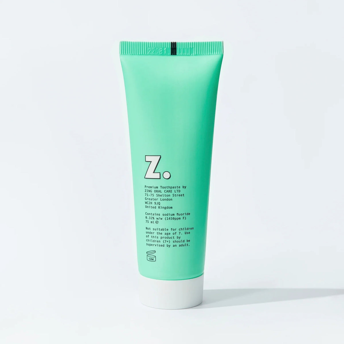 Zing mint enamel whitening toothpaste in a bright green squeeze tube with white cap