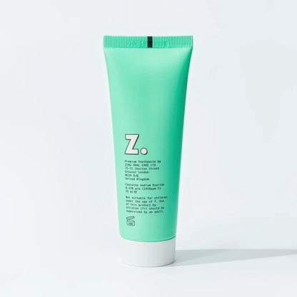 Zing mint enamel whitening toothpaste in a bright green squeeze tube with white cap