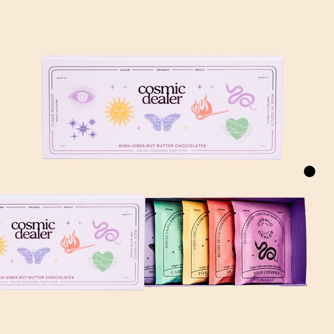 Cosmic Dealer gift box containing seven assorted organic vegan nut butter dark chocolate squares in colorful wraps