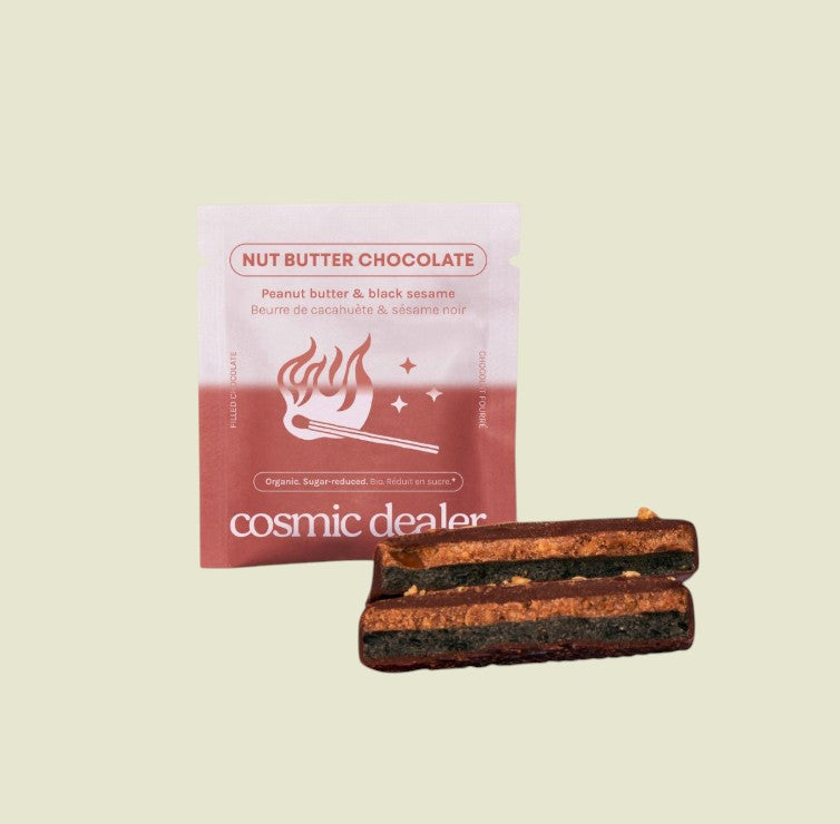 Cosmic Dealer dark chocolate squares filled with peanut butter and tahini, featuring chai spice and date sugar.