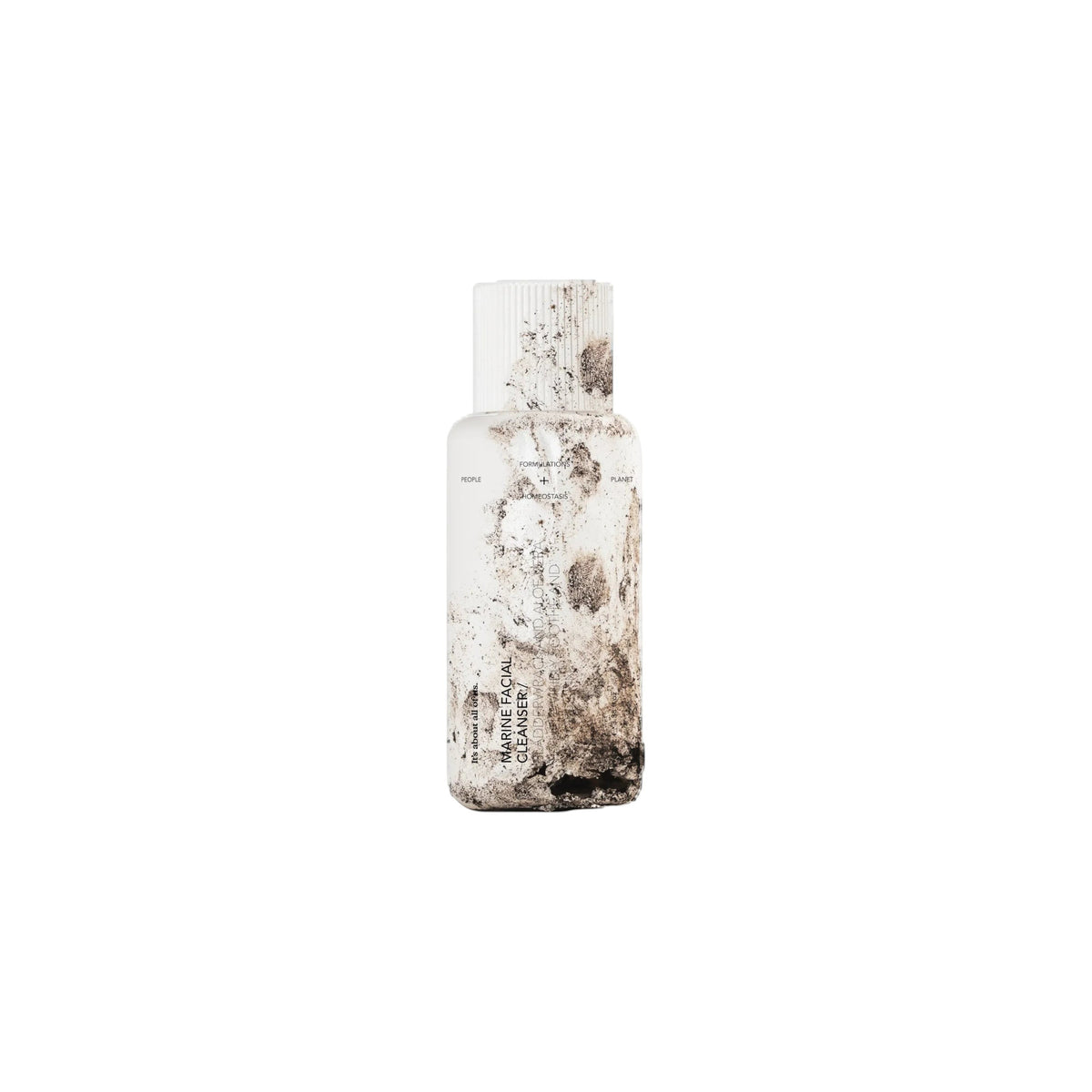 dulcie Marine Facial Cleanser in a white, compostable bottle with textured, earthy seaweed-inspired design details.