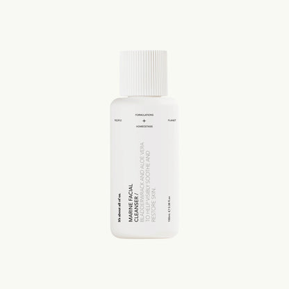 dulcie Marine Facial Cleanser in a white, home-compostable bottle with minimalist black text on a light background.