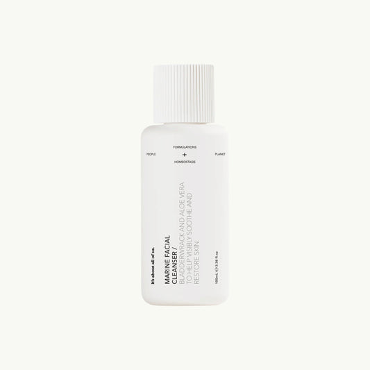 dulcie Marine Facial Cleanser in a white, home-compostable bottle with minimalist black text on a light background.