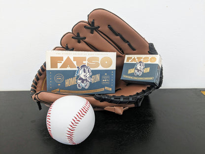 FATSO Mini Home Run dark chocolate bars with salted pretzels, almonds, and honeycomb, displayed with a baseball glove