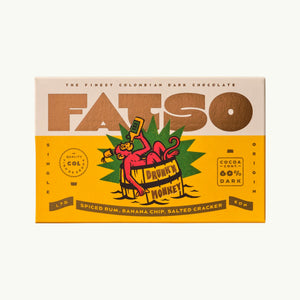 FATSO Drunk'n Monkey 60% dark chocolate bar with spiced rum, banana chips, and sea salt in yellow packaging.