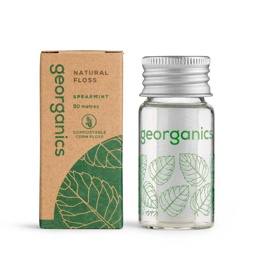 georganics natural spearmint dental floss in a refillable glass dispenser with a cardboard box, plastic-free and vegan.