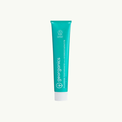 Georganics fresh mint toothpaste tube with hydroxyapatite and fluoride for gentle enamel polishing