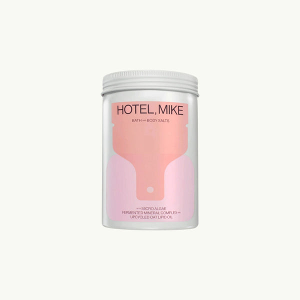 Hotel Mike Bath and Body Salts in a recyclable jar with pink label featuring micro algae and upcycled oat lipid oil