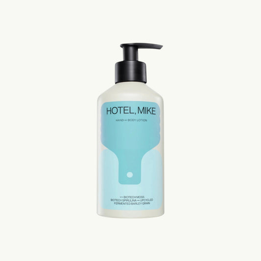 Hotel, Mike hand and body lotion in a sustainable aluminium bottle with a black pump dispenser.