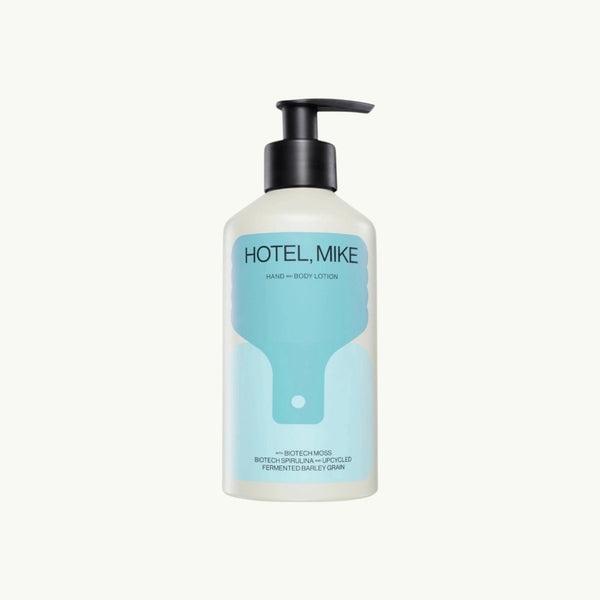 Hotel, Mike hand and body lotion in a sustainable aluminium bottle with a black pump dispenser.
