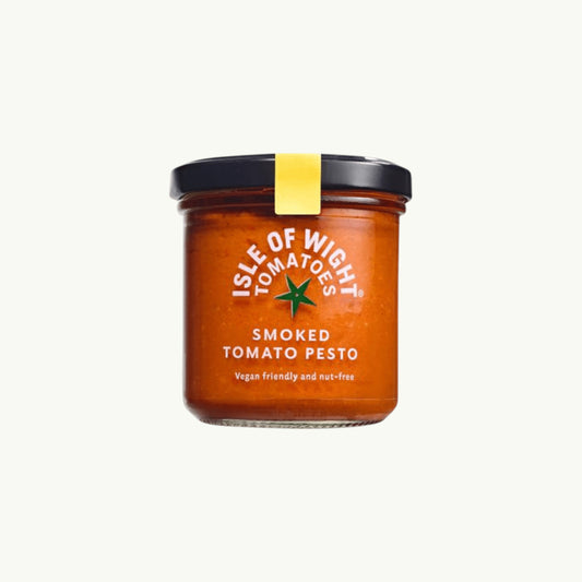 Isle of Wight Tomatoes Isle of Wight Smoked Tomato Pesto in a glass jar, a vegan and nut-free sauce with roasted tomato and paprika.