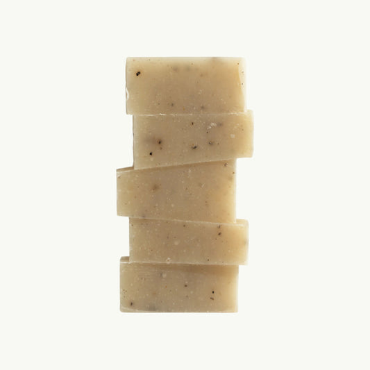 dulcie exfoliating seaweed soap block with natural wrack extract, aloe vera, and tea tree for soft, hydrated skin.