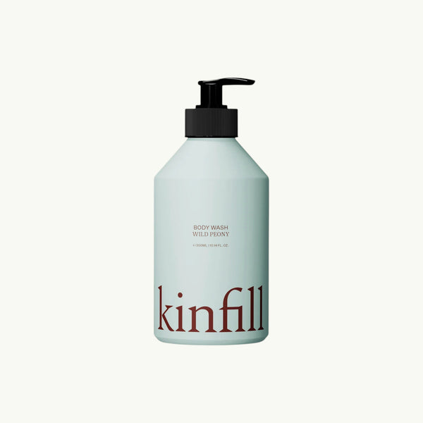 Kinfill Wild Peony body wash in a refillable light blue aluminium bottle with a black pump dispenser.