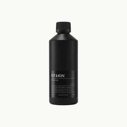 Kit & Kin plant-based dishwasher rinse aid in a black bottle with minimalist label design