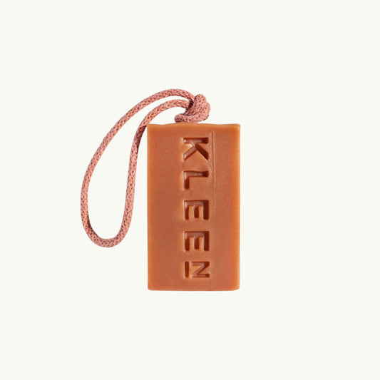 BRiMM Good Vibrations soap-on-a-rope in a warm terracotta colour with the KLEEN logo embossed on the bar.