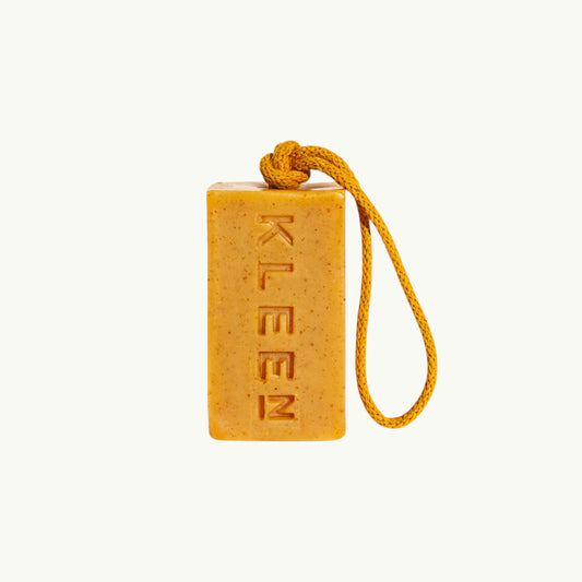 BRiMM Yellow Mellow handcrafted soap bar with turmeric and oatmeal, featuring a hanging rope and embossed logo