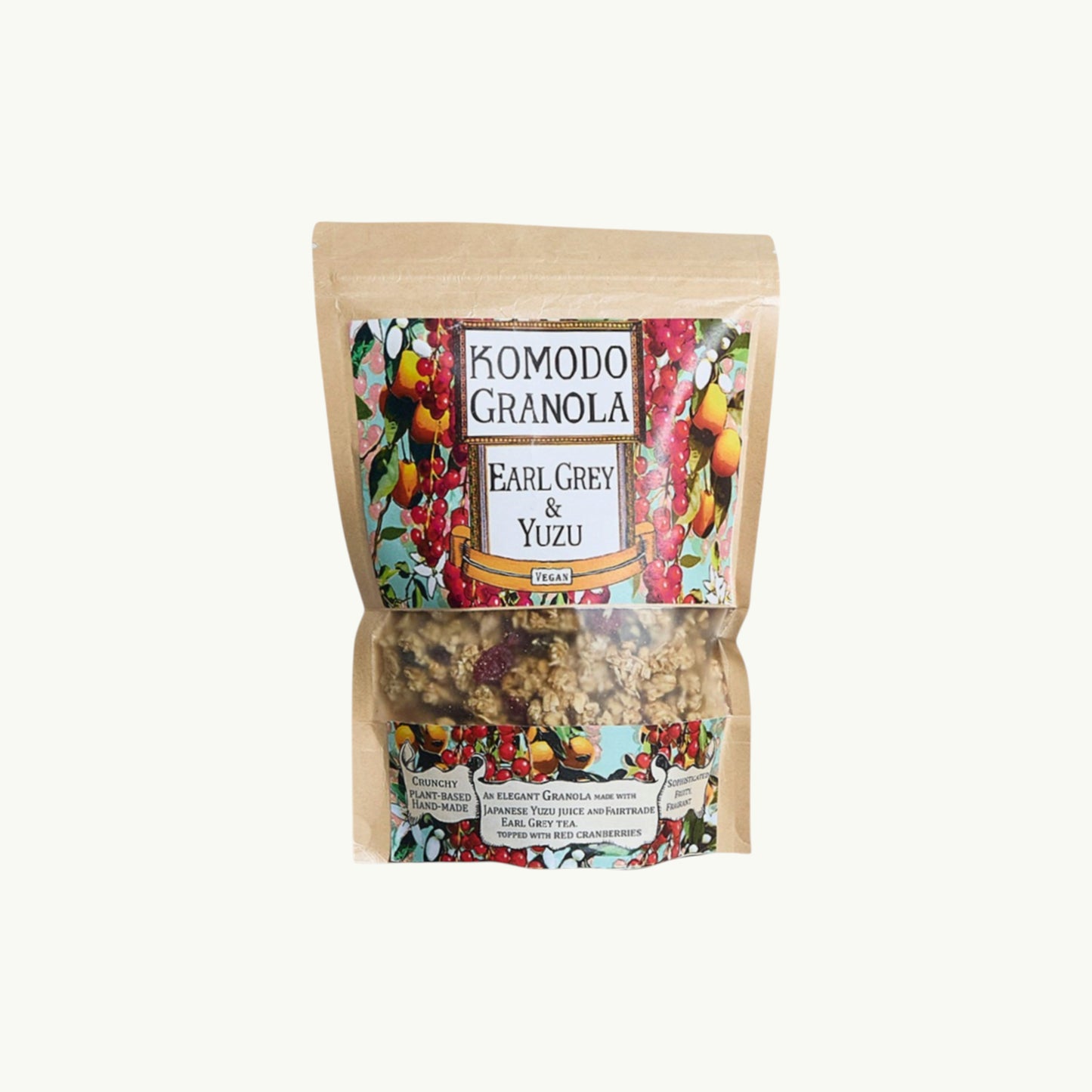 Komodo Bakery Earl Grey and Yuzu granola in a clear window pouch with vibrant botanical label art.