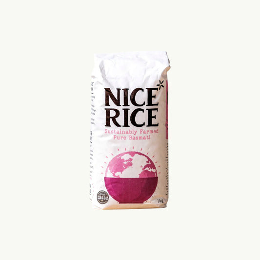 Nice Rice sustainably farmed pure basmati rice in a 1kg white bag with pink globe graphic
