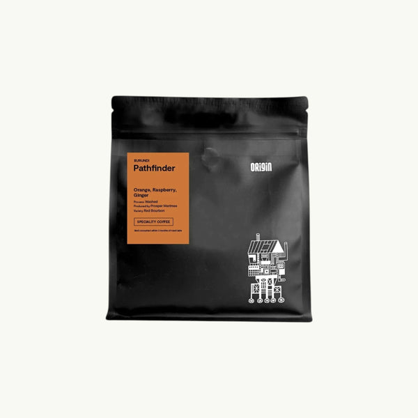 BRiMM Pathfinder whole bean coffee in a black matte bag with an orange label featuring tasting notes.