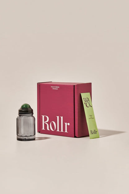 Rollr refillable glass roll-on deodorant bottle with green aventurine roller and vetiver and lemon refill pack.