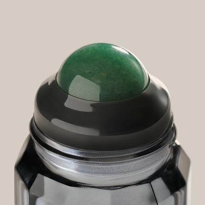 rollr refillable roll-on deodorant featuring a smooth green aventurine stone roller ball in a sleek glass bottle
