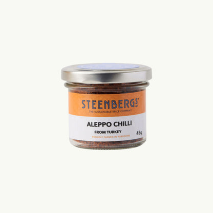 Steenbergs organic Aleppo chilli flakes in a recyclable glass jar, a mild Turkish spice for Mediterranean dishes.