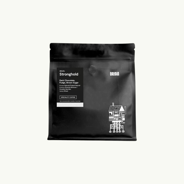 BRiMM Stronghold whole bean coffee in a matte black resealable bag with white label and graphic illustration