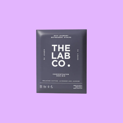The Lab Co. Relaxing Laundry Detergent Strips in dark purple plastic-free packaging for 32 loads, shown from a different angle.