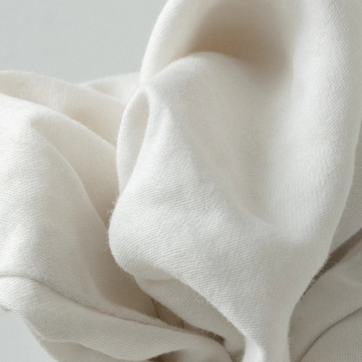 The Lab Co. soothing laundry detergent strips featuring a soft white fabric texture for a clean wash.