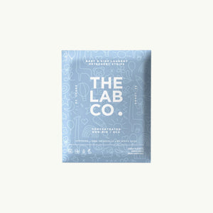 The Lab Co. soothing laundry detergent strips in light blue packaging with playful white line art illustrations.
