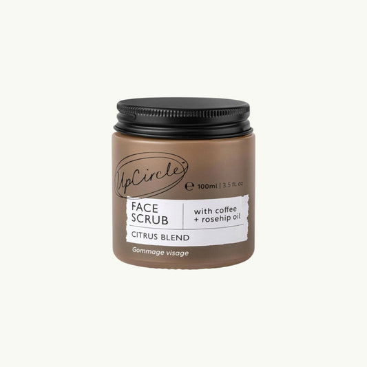 BRiMM face scrub in a brown glass jar with a black aluminium lid, featuring coffee and rosehip oil ingredients.