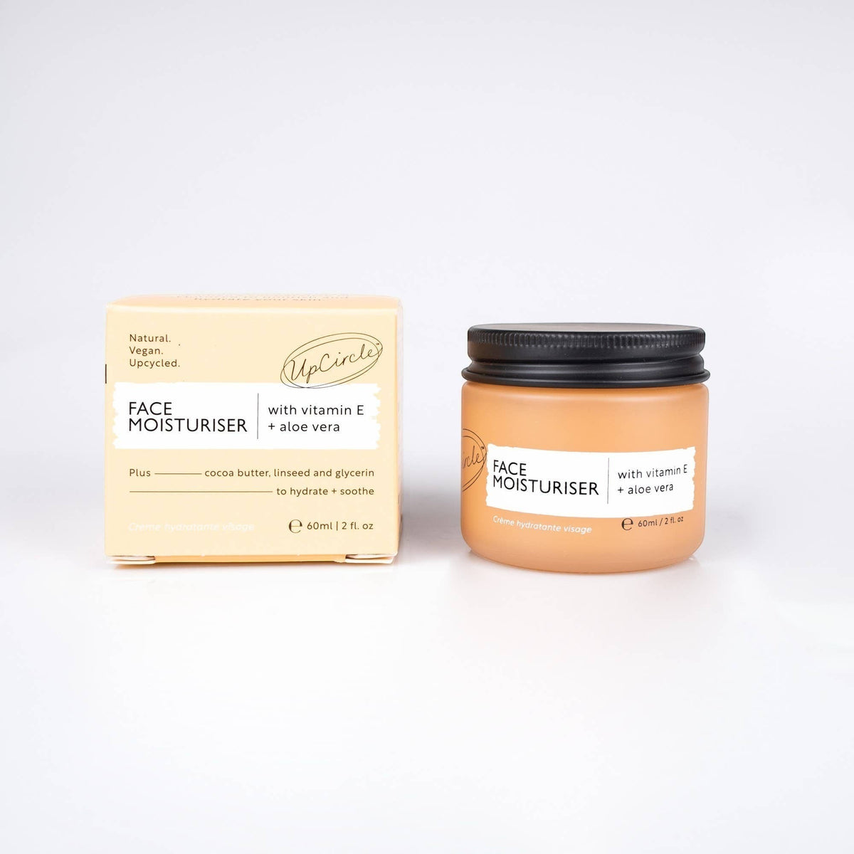 upcircle face moisturiser with vitamin E and aloe vera in a glass jar with a recyclable aluminium lid and paper box.