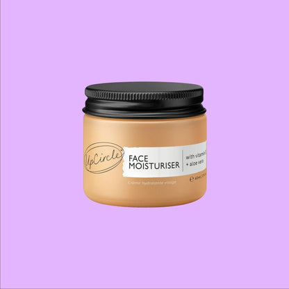 upcircle face moisturiser in a glass jar with a black aluminium lid, featuring vitamin E and aloe vera (view 2).
