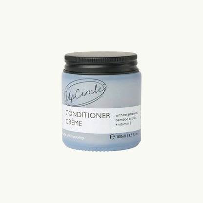 UpCircle natural hair conditioner crème in a frosted glass jar with rosemary oil and bamboo extract