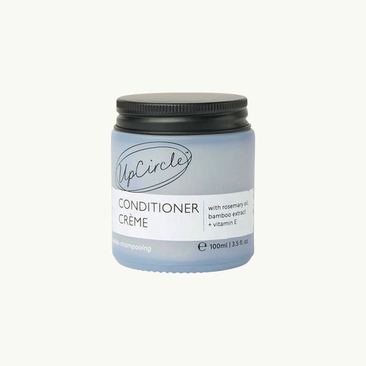 BRiMM UpCircle natural hair conditioner crème in a frosted glass jar with rosemary oil and bamboo extract