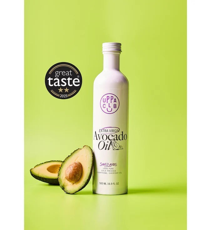 uppaclub extra virgin avocado oil bottle with a halved avocado on a bright green background and Great Taste award seal.