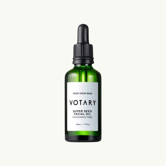 Votary Super Seed Facial Oil in a green glass bottle with a black dropper pump for sensitive skin care.