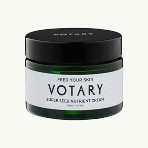 Votary Super Seed Nutrient Cream in a dark green glass jar with a black lid for hydrating and antioxidant skincare.