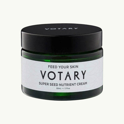 Votary Super Seed Nutrient Cream in a dark green glass jar with a black lid for hydrating and antioxidant skincare.