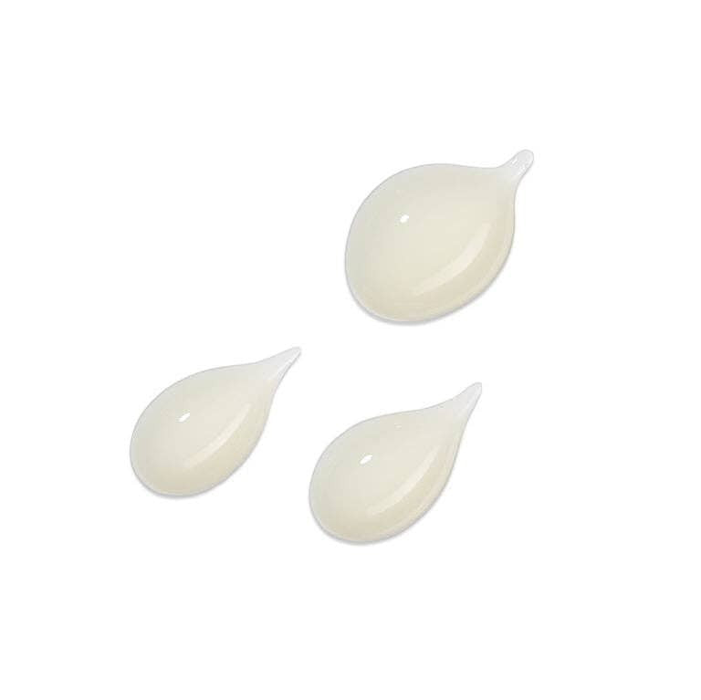 Votary Super Seed Serum in three creamy white droplets, showcasing the light, hydrating texture of the formula.
