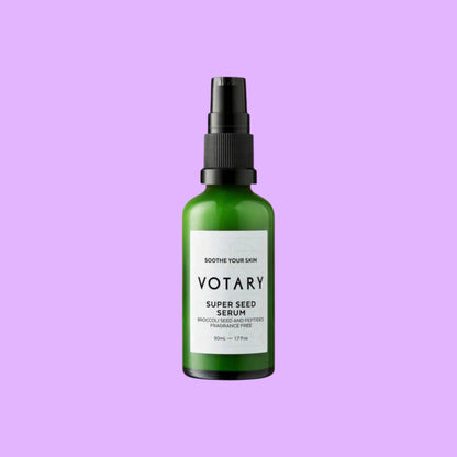 Votary Super Seed Serum in a green glass bottle with a black pump, designed to soothe and hydrate sensitive skin.