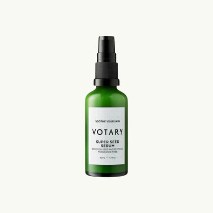 Votary Super Seed Serum in a green glass bottle with a black pump, designed to soothe and hydrate sensitive skin.